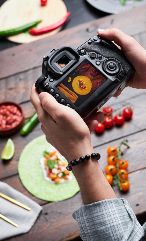 Man making photo of food on camera